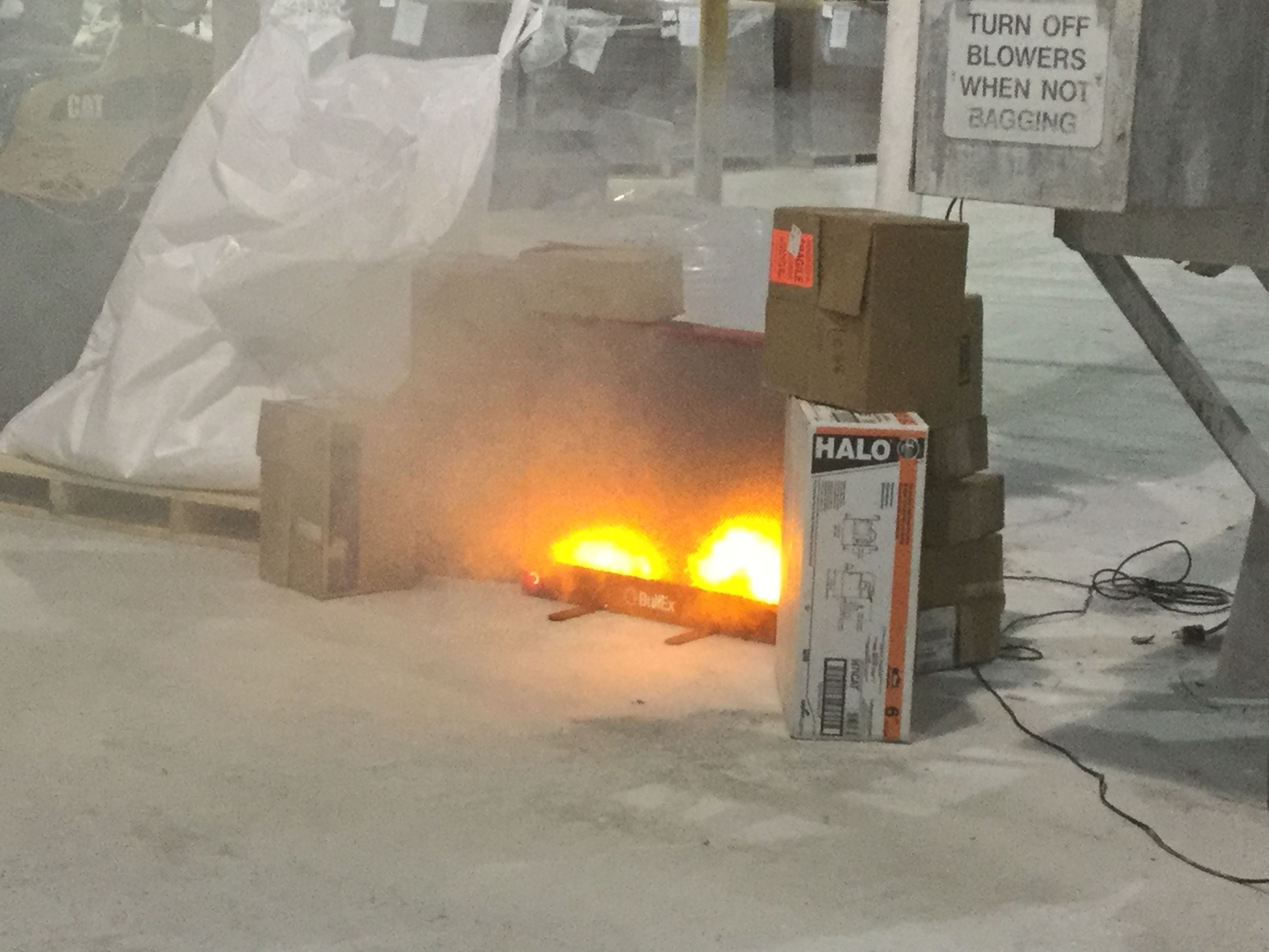 A small fire is set up for fire extinguisher training