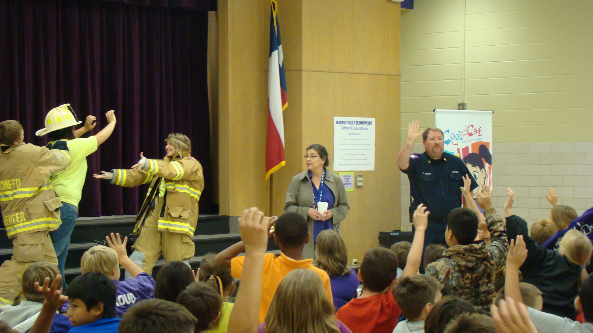 Firefighters speak at an event for children